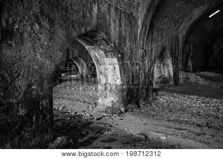 The interior of the shipyard (Tersane) in the ruins of a medieval fortress (Alanya Castle). Alanya. Turkey. Black and white.