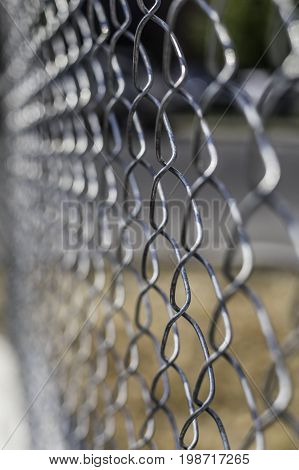 Chain link fence with shallow depth of field
