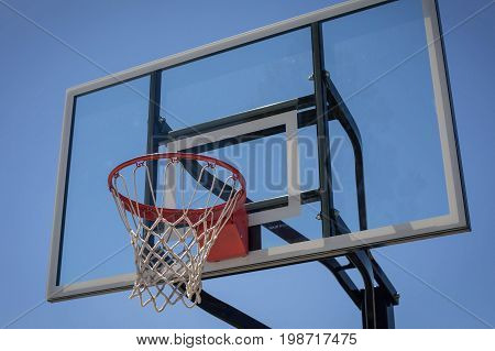 Basketball hoop in a new park on a clear day