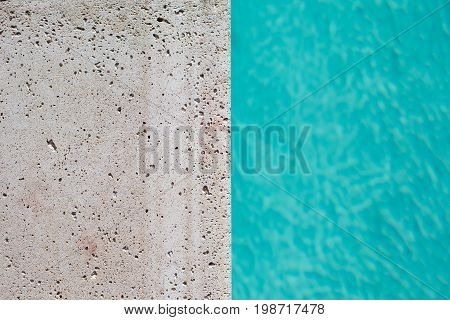 Pool water with concrete edge split down the middle