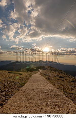 Hikers walking on a mountain at sunset in Navacerrada Madrid. Spain