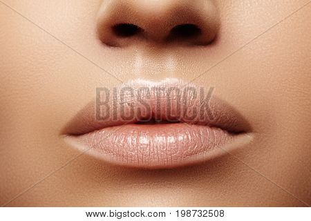 Close up plump Lips. Lip Care Augmentation Fillers. Macro photo with Face detail. Natural shape with perfect contour. Close-up perfect natural lip makeup beautiful female mouth. Plump sexy full lips