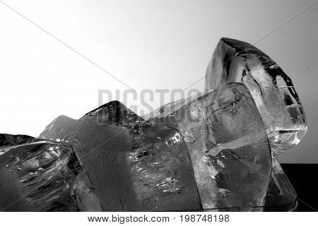 Ice block / An ice cube is a small, roughly cube-shaped piece of ice, conventionally used to cool beverages
