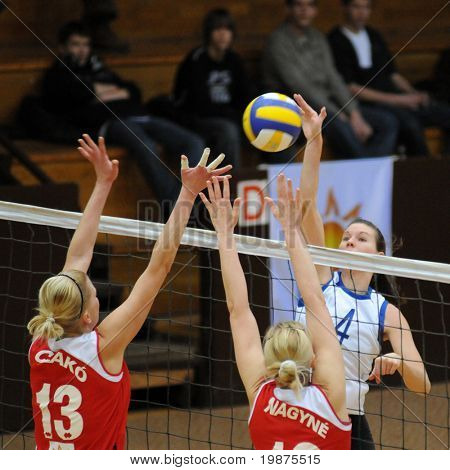 KAPOSVAR, HUNGARY - FEBRUARY 4: Zsuzsanna Czmerk (4) strikes the ball in the Hungarian Cup woman volleyball game Kaposvar vs Vasas, February 4, 2009 in Kaposvar, Hungary.