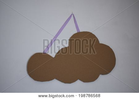 Paper Cloud on the white wall is brown