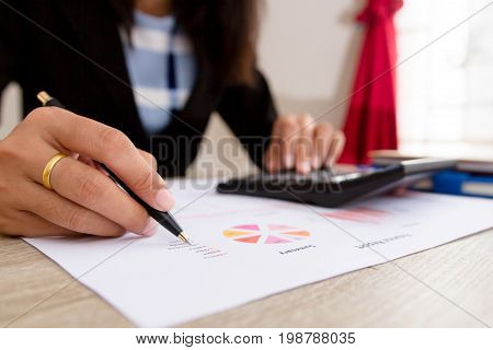 Businesswoman calculate about cost and doing finance at office, Finance managers task,Concept business and finance investment
