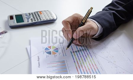 Businessmen working with graph data at officeFinance managers taskConcept business and finance investment