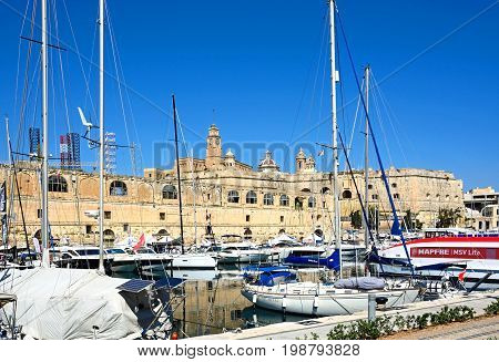 VITTORIOSA, MALTA - MARCH 31, 2017 - View of Vittoriosa and Senglea marina with Senglea waterfront buildings to the rear Vittoriosa (Birgu) Malta Europe, March 31, 2017.