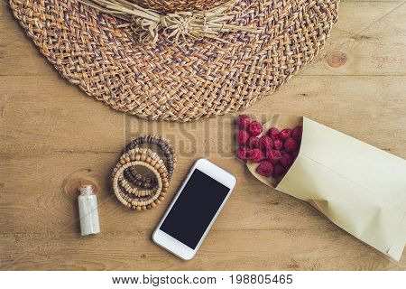 Summer Holiday, Vacation, Relaxation Concept. Raspberries, Straw Hat, Smartphone, Sunglasses From Ab