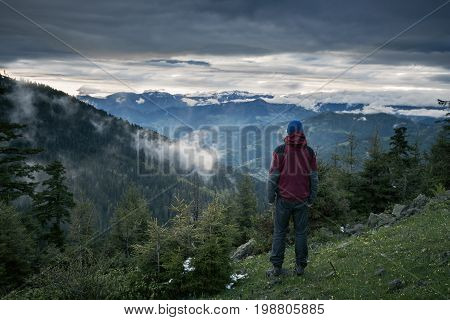 Meditating Adventurer Admiring Epic View Of The Mountains