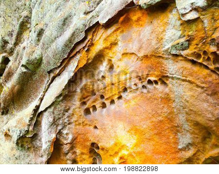 Sandstone texture with colorful ornments made by iron.