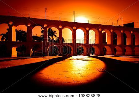 Sun Shines Through Landmark Lapa Arch in Rio de Janeiro City Downtown