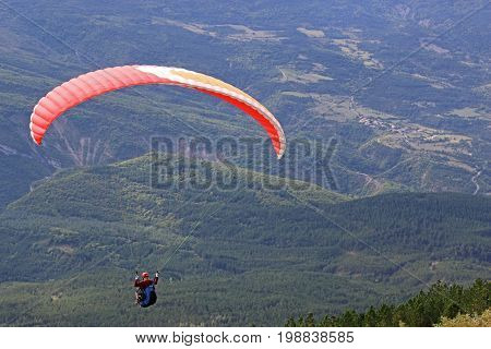 Paraglider flying wing in the French Alps