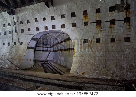 Tiled tunnel in abandoned underground nuclear physics laboratory, Sukhum, Abkhazia