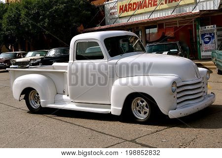 CASSELTON, NORTH DAKOTA, July 27, 2017: The annual Casselton Car Show which occurs the last Thursday of July features classic vehicles such as the restored 1949 white Chevy pickup