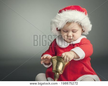 portrait of cute female caucasian child with santa claus clothes
