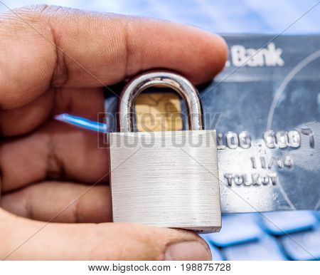 Credit cards and simle mechanical lock. Security concept.