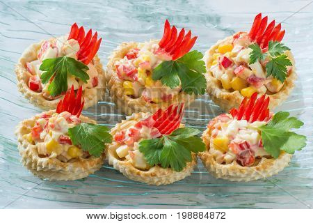 Vol-au-vent filled with chicken salad sweet pepper egg and corn. Festive appetizer for Christmas Valentine's Day Easter. Colorful snack of French cuisine from air puff pastry with filling