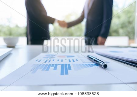 Young executive colleagues discussing and analysis working with new startup project Financial investment on tablet Analyze business and market growth on financial document data graph handshake.