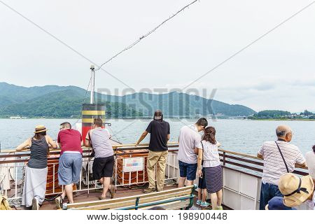 YAMANASHI JAPAN - July 24 2017 Tourists with Sightseeing boat in the lake of Kawaguchi