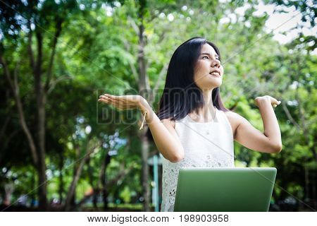 Attractive Successful Young Girl With Laptop Outdoors. Beautiful Woman With Notebook, Working On Com