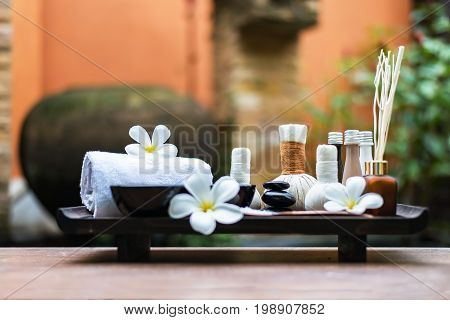 Spa massage compress balls herbal ball on the wooden with treaments spa Thailand select focus