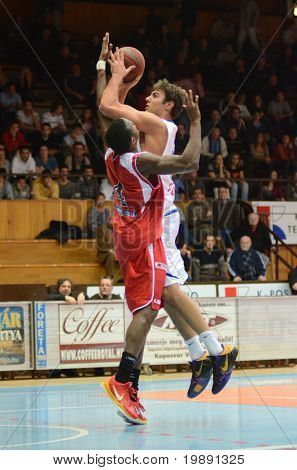 KAPOSVAR, HUNGARY - NOVEMBER 27: Dan Werner (R) in action at a Hungarian Championship basketball game Kaposvar vs. Kormend November 27, 2010 in Kaposvar, Hungary.