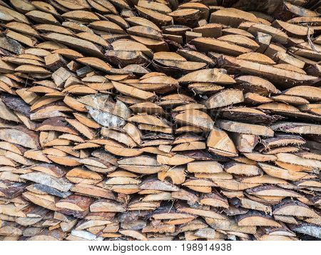The boards stacked on top of each other. Boards of pine, view of the end. Lying trimming boards. Firewood for heating the house and kindling. Wood for the stove. Background with texture of the wood.