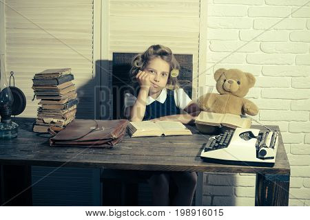 Child With Briefcase And Typewriter On Table.