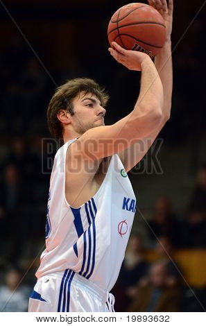 KAPOSVAR, HUNGARY - JANUARY 12: Dan Werner (in white) in action at a Hugarian Cup basketball game Kaposvar vs. Paks January 12, 2011 in Kaposvar, Hungary.