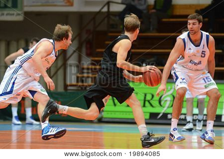 KAPOSVAR, HUNGARY - JANUARY 22: Laszlo Kalman (C) in action at a Hungarian National Championship basketball game Kaposvar vs Szombathely January 22, 2011 in Kaposvar.