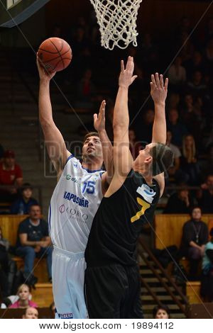 KAPOSVAR, HUNGARY - JANUARY 22: Dan Werner (L) in action at a Hungarian National Championship basketball game Kaposvar vs Szombathely January 22, 2011 in Kaposvar.