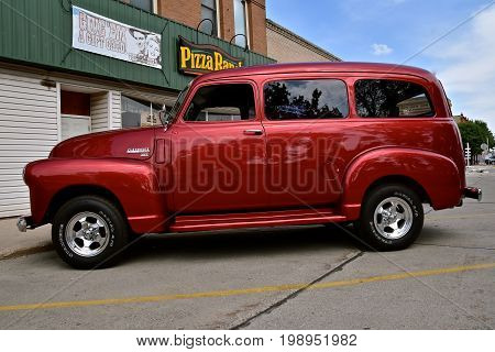 CASSELTON, NORTH DAKOTA, July 27, 2017: The annual Casselton Car Show which occurs the last Thursday of July features classic vehicles such as the restored and customized 1949 Chevy passenger van.