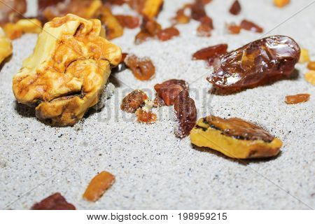 Amber. the pieces of amber in the sand on the beach. Sun stone natural mineral on the beach. Amber Shine on the beach. Amber Baltic sand