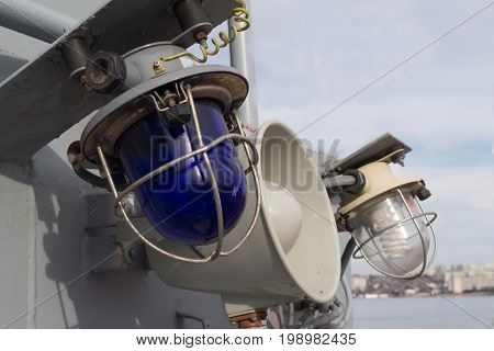 Military blue and white laterns and horn on the ship