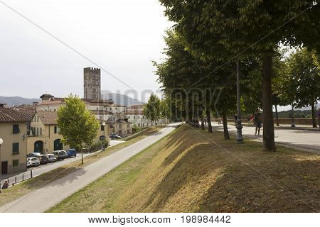 LUCCA, ITALY - AUGUST 15 2015: Pedestrian path surrounding Lucca fortified walls boudaries