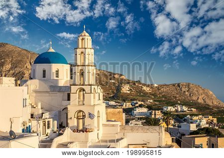 Pyrgos, Santorini island, Greece. Cycladic traditional village with blue domes of churches and white houses.