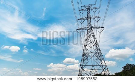 High voltage pole and beautiful sky across the paddy field
