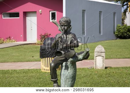 Bayamon/puerto Rico - February 26, 2019: Statue Of Child Playing Trumpet Inside Central Park For Kid