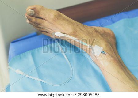 Patient With Saline Intravenous In The Hospital