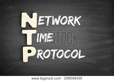 Wooden Alphabets Building The Word Ntp - Network Time Protocol Acronym On Blackboard
