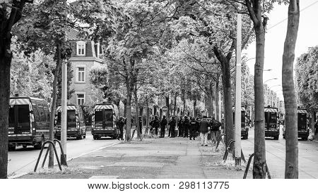 Strasbourg, France - Apr 28, 2019: Rear View Of Squadron Of Police Officers Securing The Alee De Rob