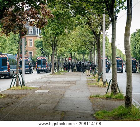 Strasbourg, France - Apr 28, 2019: Rear View Of Squadron Of Police Officers Securing The Alee De Rob