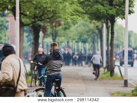 Strasbourg, France - Apr 28, 2019: Rear View Of Man Taking Photo On Smartphone Of Police Gendarmerie