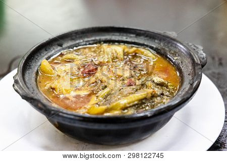 Traditional Chinese Sour Spicy Mustard Vegetable Delicacy In Claypot