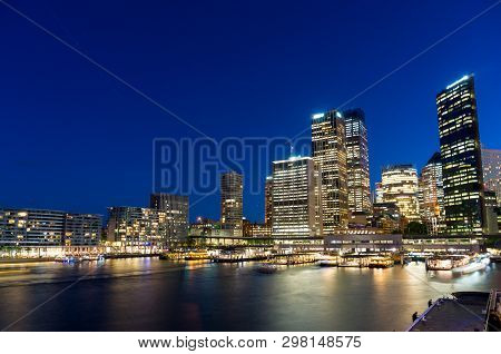 Sydney Skyline At Night. Business Office Buildings And Circular Quay Cityscape. Sydney, Australia