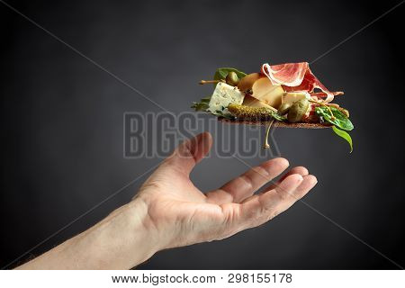 Conceptual Image On The Theme Of Fine Food And Delicacies. Сracker With Blue Cheese, Prosciutto And 