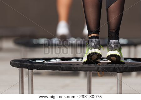 Fitness Women Jumping On Small Trampolines, Exercise On Rebounder