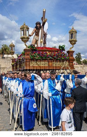 Merida, Spain. April 2019: A Group Of Bearers, Called Costaleros, Carrying A Religious Float