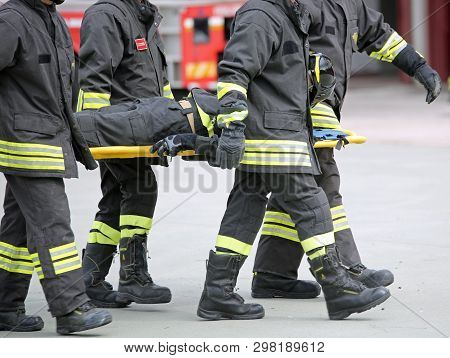 Rome, Rm, Italy - May 10, 2018: Italian Corpsmen Firefighters Transport An Injured On The Stretcher 